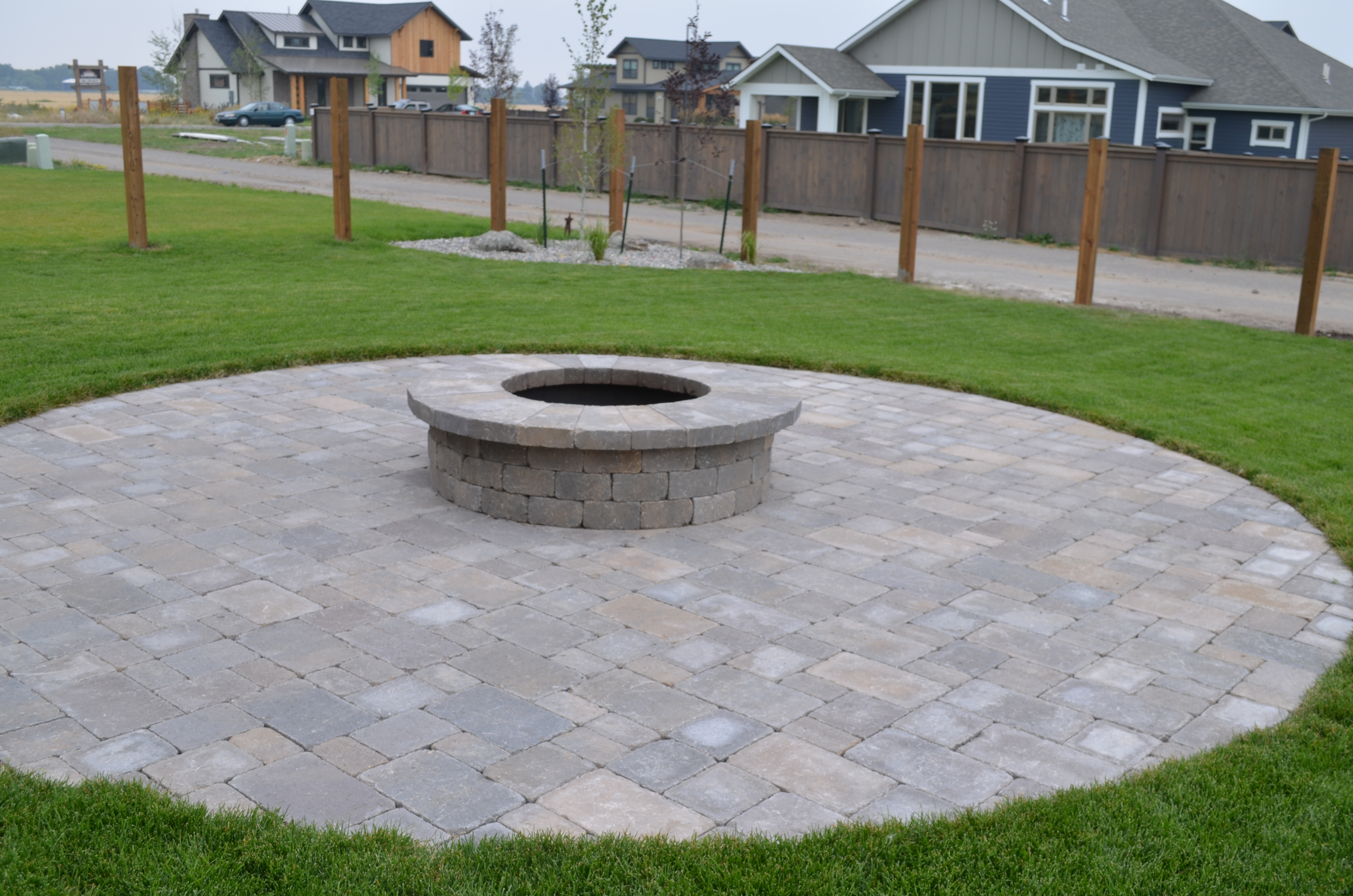 Fire pit, patio and walkway made of pavers. Full landscape installation as well.