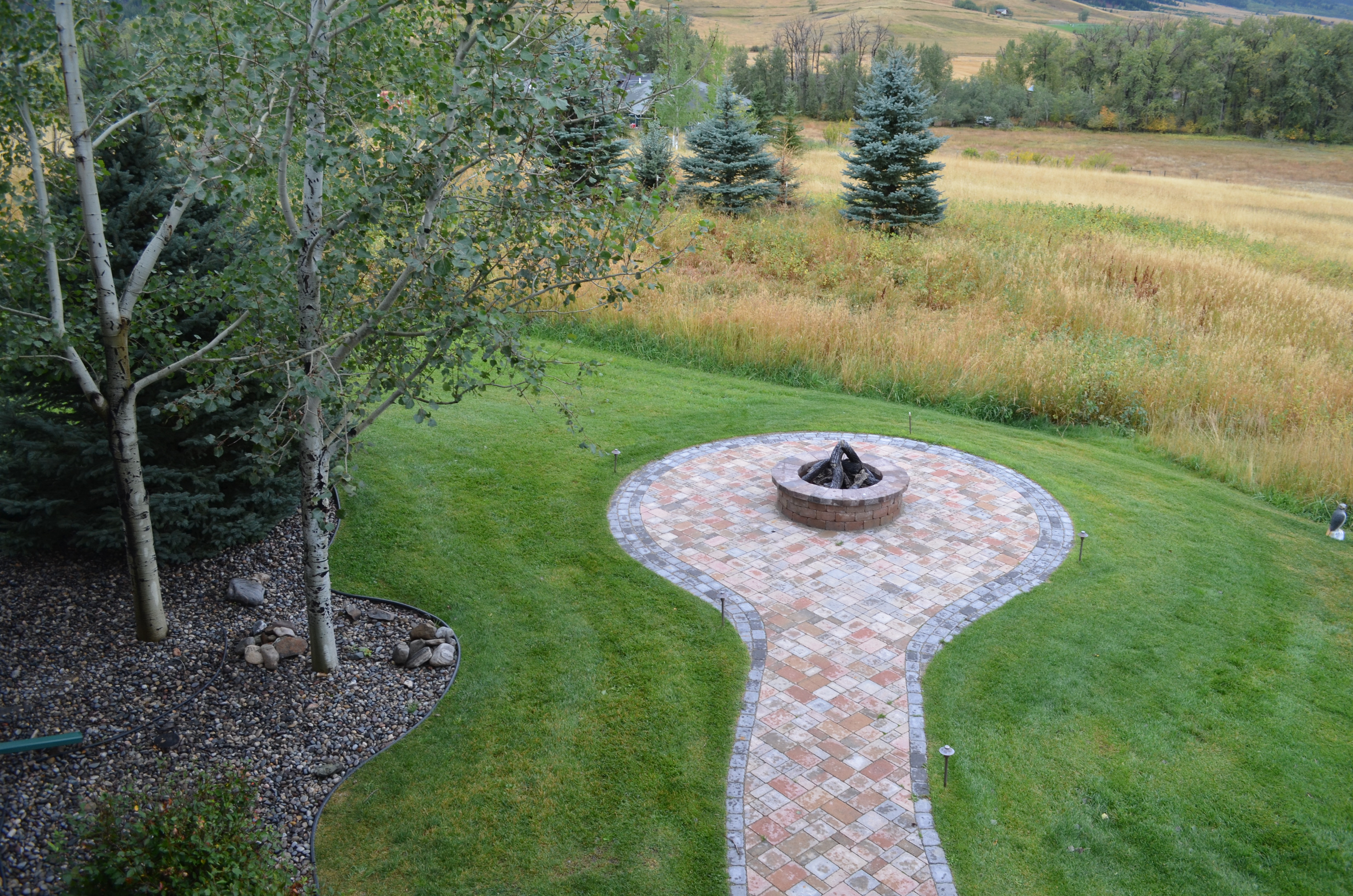 Fantastic custom paver patio, walkway & fire pit; as well as. full landscape installation.